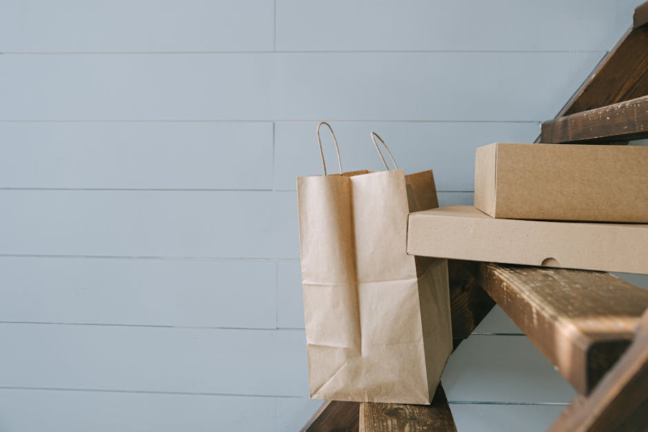 Minimalist image of paper and cardboard packaging on stairs, perfect for e-commerce themes.